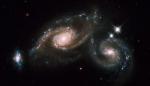 Триплет галактик Arp 274. В эту систему входят две спиральные галактики и одна неправильной формы. Объект находится в созвездии Девы.